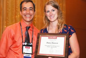 Dana Hansen upon receiving her award from NACADA President David Spight 