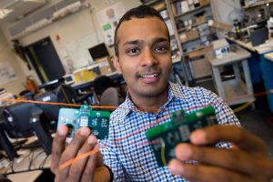 Assistant Professor Shyam Gollakota, holding the passive Wi-Fi devices. Photo credit: MIT EECS