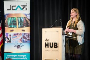 Claire Watts presents at the JCATI Symposium.