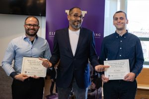 Vikram Jandhyala presents the Endowed Innovation Award in Electrical Engineering to Max Pfeiffer (Undergraduate Award) and Sep Makhsous (Graduate Award).